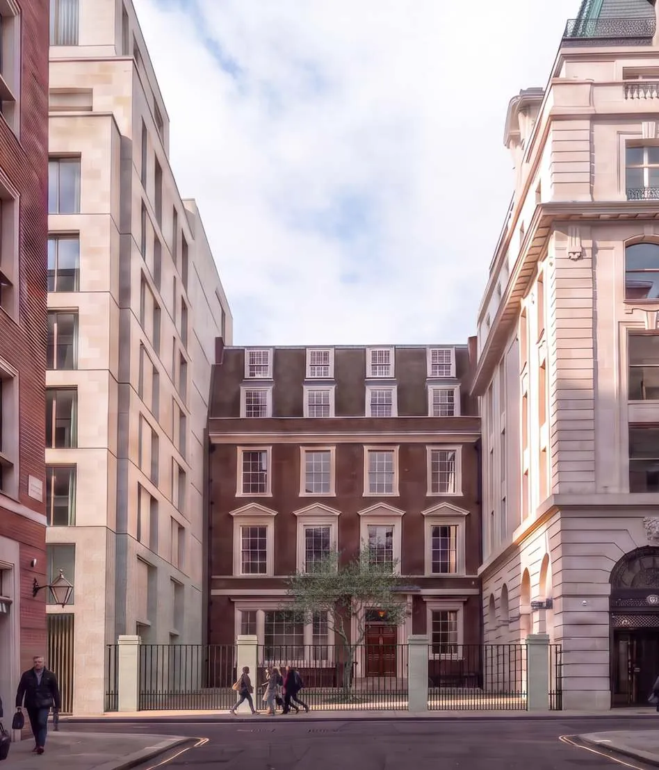 Proposed view from Bennet Street: stone elevations framing the retained brick townhouse, with a tree in the forecourt.